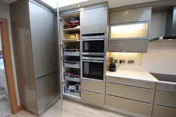 Photo of a modern kitchen with built-in appliances in an apartment