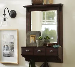 Wall mirror for hallway with shelf photo