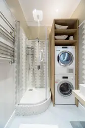 Bath design with shower and washing machine photo