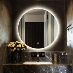 Round mirror in the bathroom interior