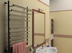 Heated towel rail in the bathroom interior