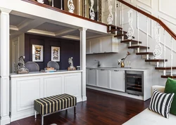 Kitchens in a room with stairs photo