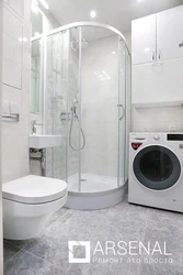 Bathroom Design With Shower And Toilet Made Of Tiles And Washing Machine