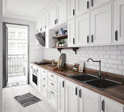 Kitchen with black handles in a white interior