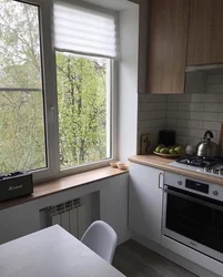 Kitchen design in Khrushchev with a window sill photo