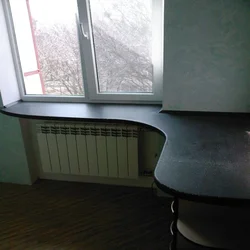 Instead of a window sill there is a countertop in the kitchen in Khrushchev photo
