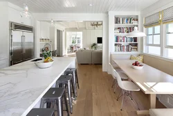 Kitchen design with a large table photo