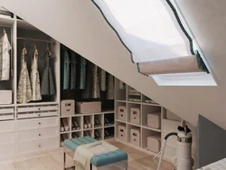 Dressing room in the attic with a sloping ceiling photo