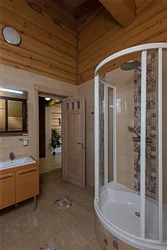 Bathroom design in a wooden house with shower