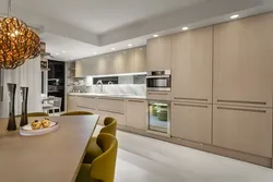 Beige kitchen design with black splashback