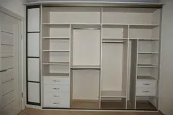 Filling a three-door wardrobe in the hallway photo