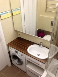 Bathroom interior with machine under sink