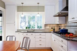 Kitchen cabinets photo corner by the window