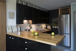 Black kitchen with wood interior design