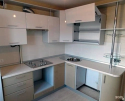 Corner kitchen units for a small kitchen with built-in appliances photo