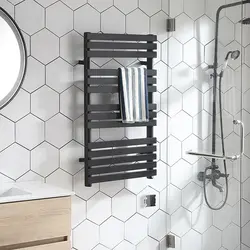 Black heated towel rail in the bathroom design
