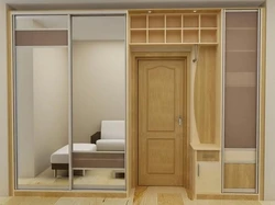 Built-in compartment doors in the hallway photo