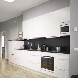 Kitchen with white appliances in the interior photo