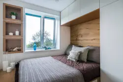 Маленькая спальня з ложкам і шафай фота