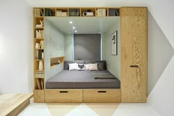 Маленькая спальня с кроватью и шкафом фото