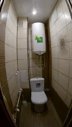 Design of a small toilet in an apartment with a water heater