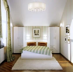 Photo of a small bedroom with a bed