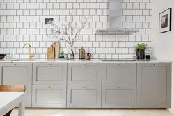 Photo of white tiles with black grout in the bathroom