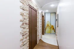 Hallway design with decorative brick and wallpaper