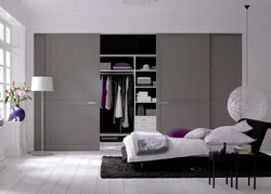 What types of wardrobes are there in the bedroom photo