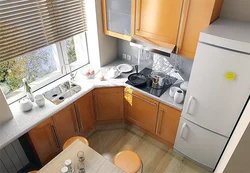 Interior of a small kitchen with a refrigerator photo