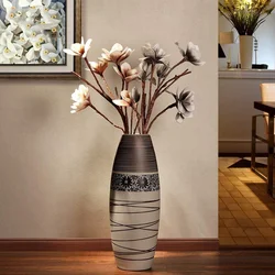 Vase in the living room interior with flowers photo