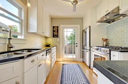 Kitchen design with a window along a long wall