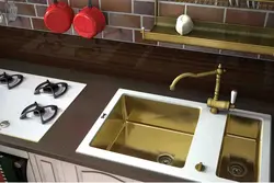 Golden sink in the kitchen interior