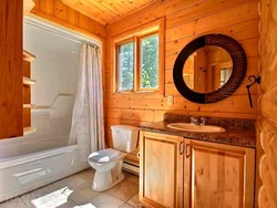 Interior of a bathroom with shower in a wooden house