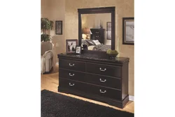 Chest of drawers with mirror in bedroom interior photo