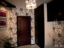 Wallpaper in a small hallway under dark doors photo