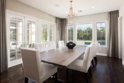 Living room design in a house with floor-to-ceiling windows