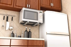 How to hang a microwave in the kitchen under the cabinets photo