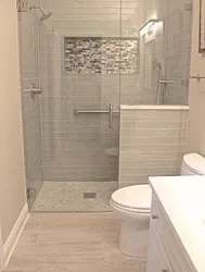 Shower In The Bathroom With A Tray Made Of Small Tiles Photo