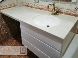 Countertop in the bathroom under the sink made of porcelain stoneware photo