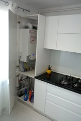 Kitchen interior with gas boiler on the floor