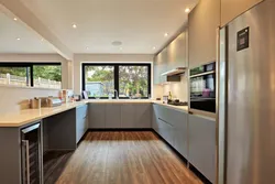 U-shaped kitchen design with a window in the middle