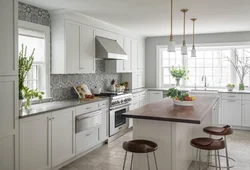 White kitchen design with gray countertop photo