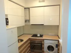 Layout in a small kitchen with a refrigerator and washing machine photo