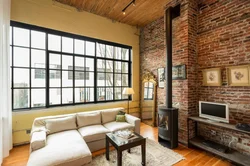 Loft-style fireplace in the living room interior