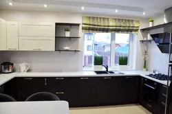 Kitchen design in a house with a window in the middle