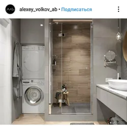 Photo of a bath with shower, sink and washing machine