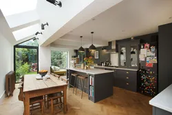 Design of a living room combined with a kitchen and access to the terrace