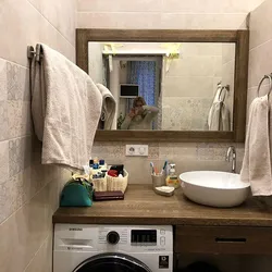 Bathroom interior with countertop for washing machine