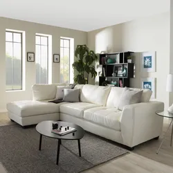White sofas in the interior of the living room photo in a city apartment